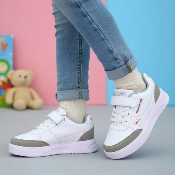 کفش اسپرت بچگانه چسبی ریبوک بهگام 122